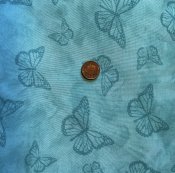 Turkos tyg med fjärilar