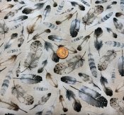 Ljust tyg med fjädrar