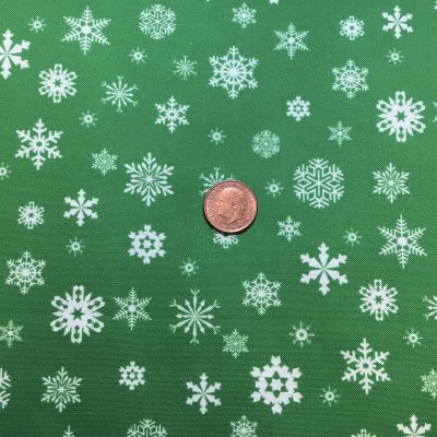 Grönt tyg med snöstjärnor