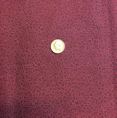 Mörkrött tyg med prickar i ciklar
