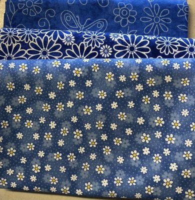 Tygpacke med blå blomster tyger