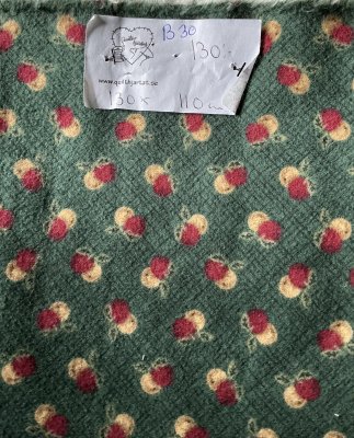 Grönt flanell tyg med äpple