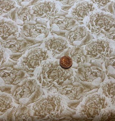 Ljust beige tyg med blommor