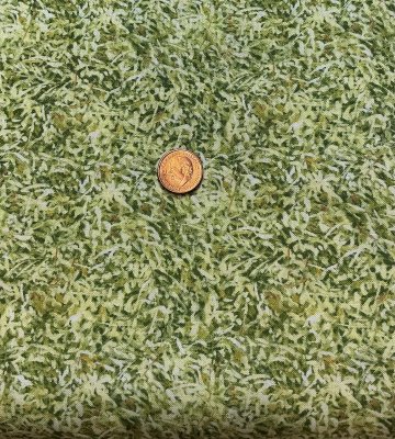 Grönt tyg med så blommor och blad