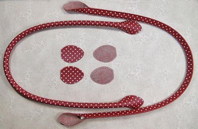 Långa röd och vitprickiga handtag ca 60 cm