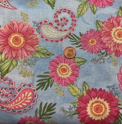 Ljusblått tyg med blommor