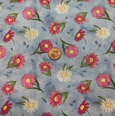 Ljusblått tyg med mindre blommor